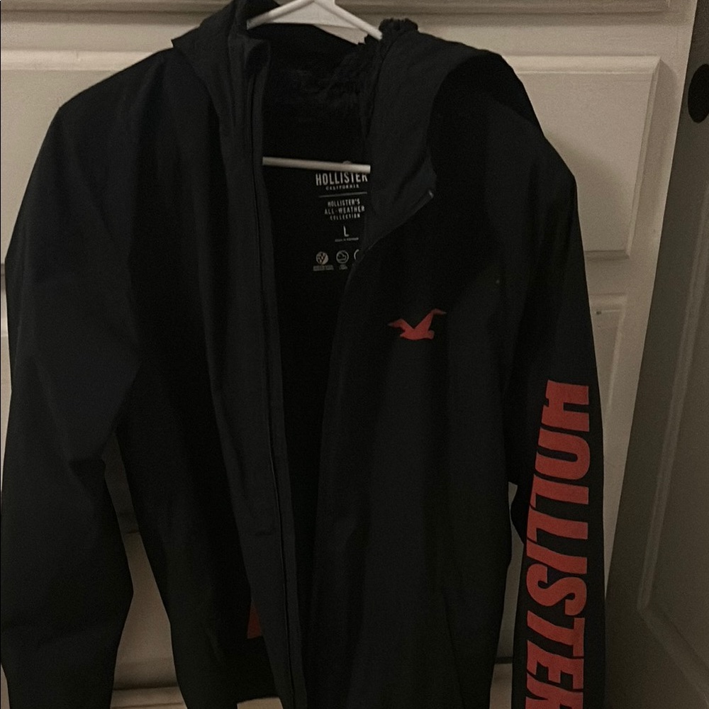 Hollister Men's Black Windbreaker with Red Accents